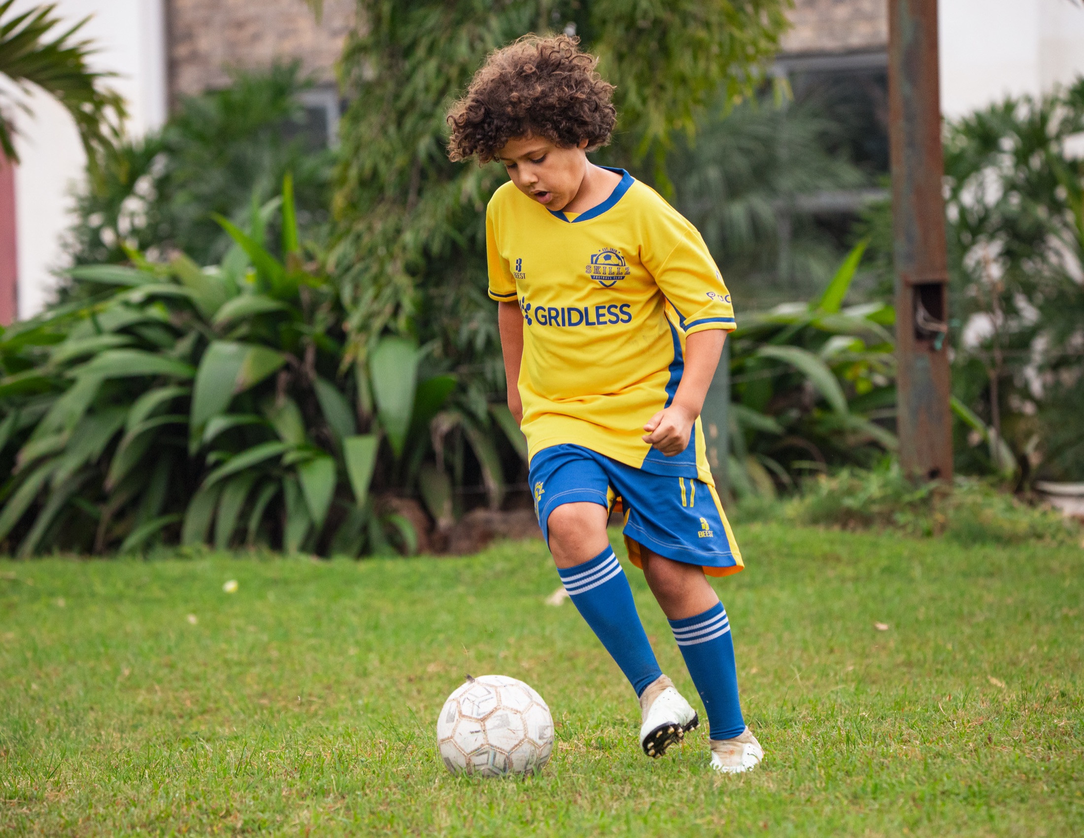Skillz FC Academy player dribbling with purpose